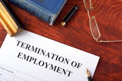 termination of employment contract with a pen, spectacles and other office items 