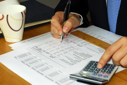 Accountant reviewing report for Corporate Transparency Act CTA