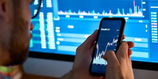 businessperson on cell phone sharing data