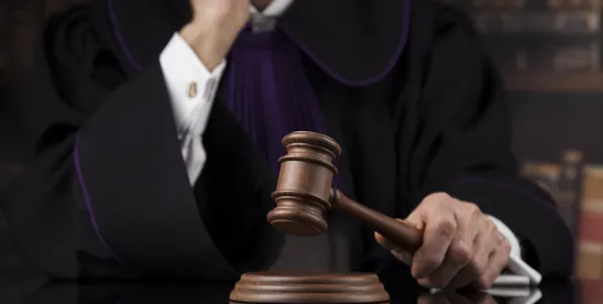 Puerto Rican Judge in a somber courtroom