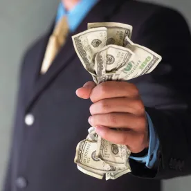 Businessman holding cash
