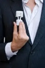 Businessman holding light bulb FERC LAW