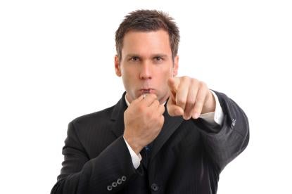 businessperson blowing whistle as part of IRS Whistleblower program