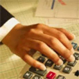 Woman with Calculator Working on Forms