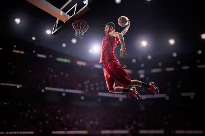 student athlete slam dunking for advertising purposes