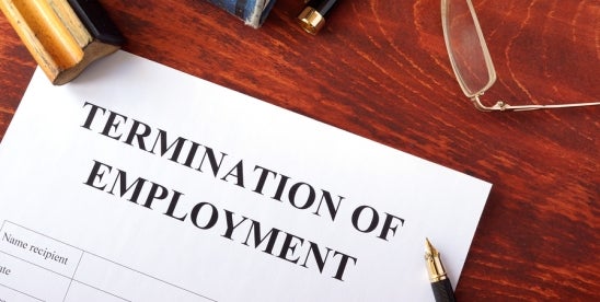 termination of employment contract with a pen, spectacles and other office items 