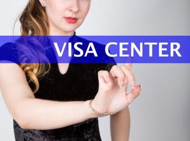 lady clicking on Visa Center for resident alien, H and L visa approval resources for US employment