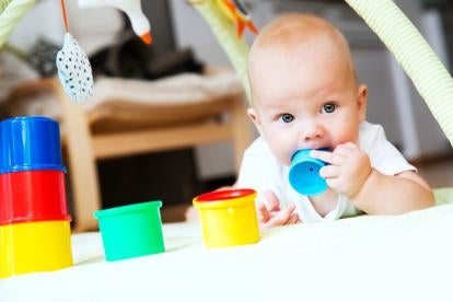 Baby with playing with plastic cups, PFOS a Priority Chemical in Children's Toys