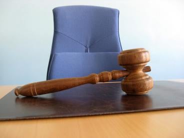 Gavel in front of Blue Chair