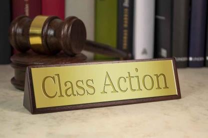 Class Action on gold plaque with gavel