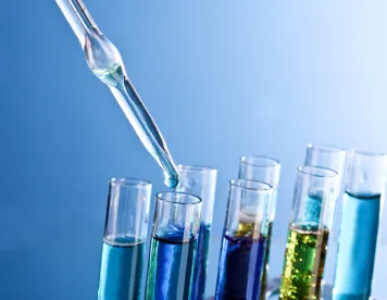 a science lab with test tubes filled with various colored liquid