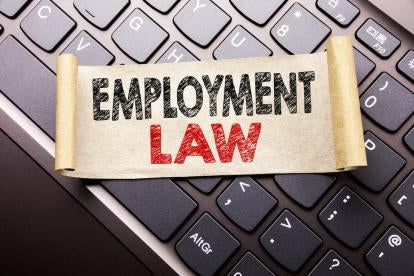 unfurled scroll stating Employment law on a keyboard