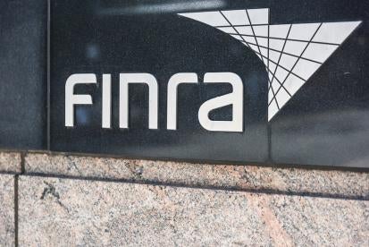 FINRA Sign on Black Wall
