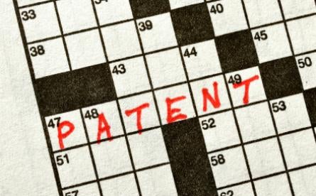 Patents and Abstract Idea; Patent in red ink on crossword