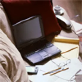 Laptop on Sofa with Work