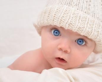 Baby with blue eyes, maternity, paternity leave