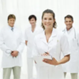 Nurse with Doctors in Background