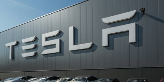 electric cars parked in front of TESLA company