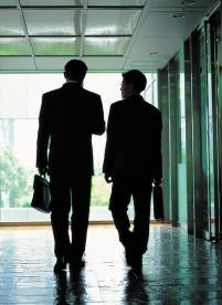 Businessmen walking, risk management directors