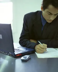 business guy, making list, tax