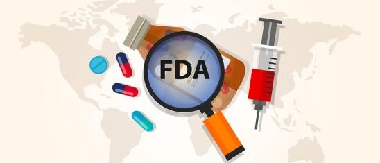 depicting FDA scrutiny with a magnifying glass titled FDA over a map of the world along with a medicine bottle, syringe and pills
