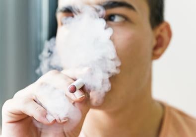 man using e-cigarette, flavored vape ban, vaping safety question