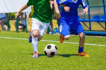 two soccer players on the field