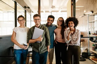 group of happy trendy younger employees