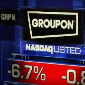groupon logo on a stock exchange board