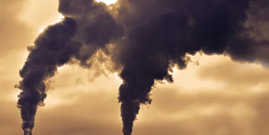 smoke billowing from a ship