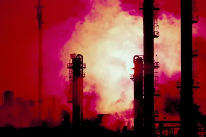 refinery smokestacks where hydroflauric acid is being used in manufacturing processes