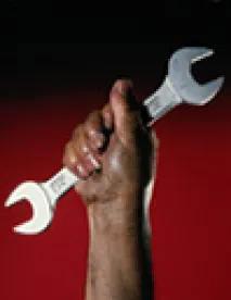 Hand holding wrench