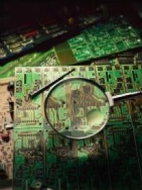 magnify glass over circuit board
