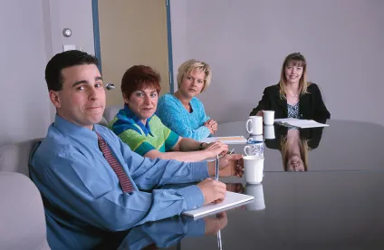 people at desk, controling shareholder