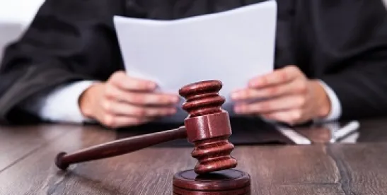 judge's gavel used in litigation courtroom to settle derivative lawsuits