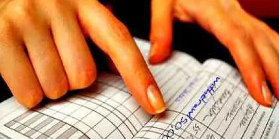 Woman pointing at checkbook