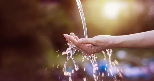 Water Running across someone's hand