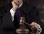 Puerto Rican Judge in a somber courtroom